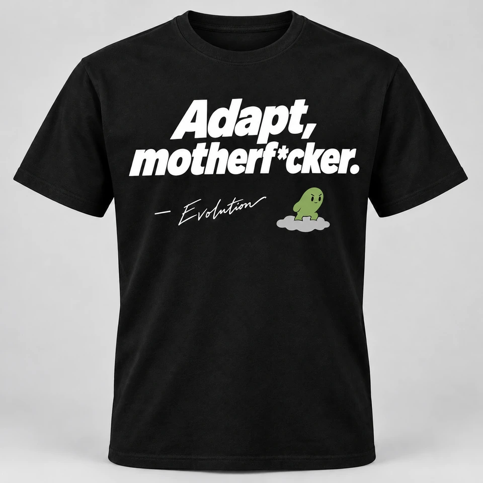 A black crewneck T-shirt mockup with “Adapt, motherf*cker.” across the front, with a smaller attribution dash, signature and Evolution mascot beneath. Complete shirt shown against the supplied studio background.
