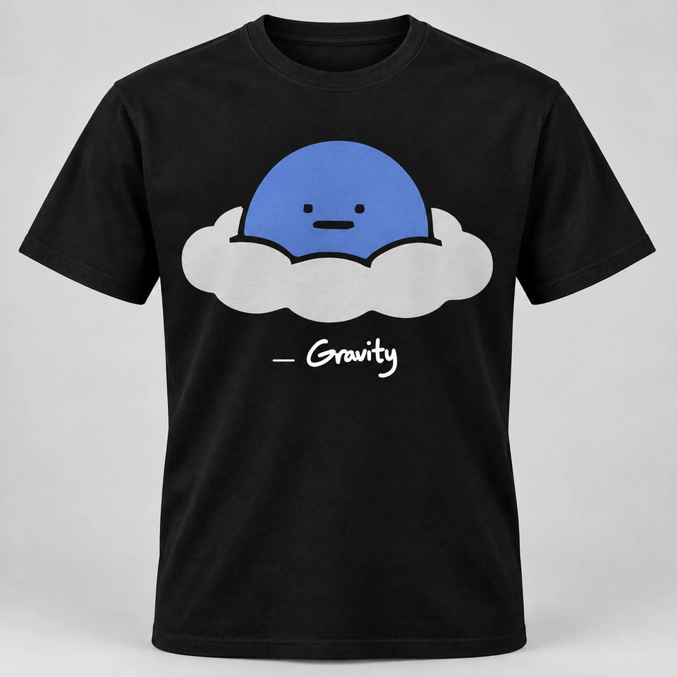 A black crewneck T-shirt mockup featuring a large Gravity mascot on the front with its signature underneath. Complete shirt shown against the supplied studio background.